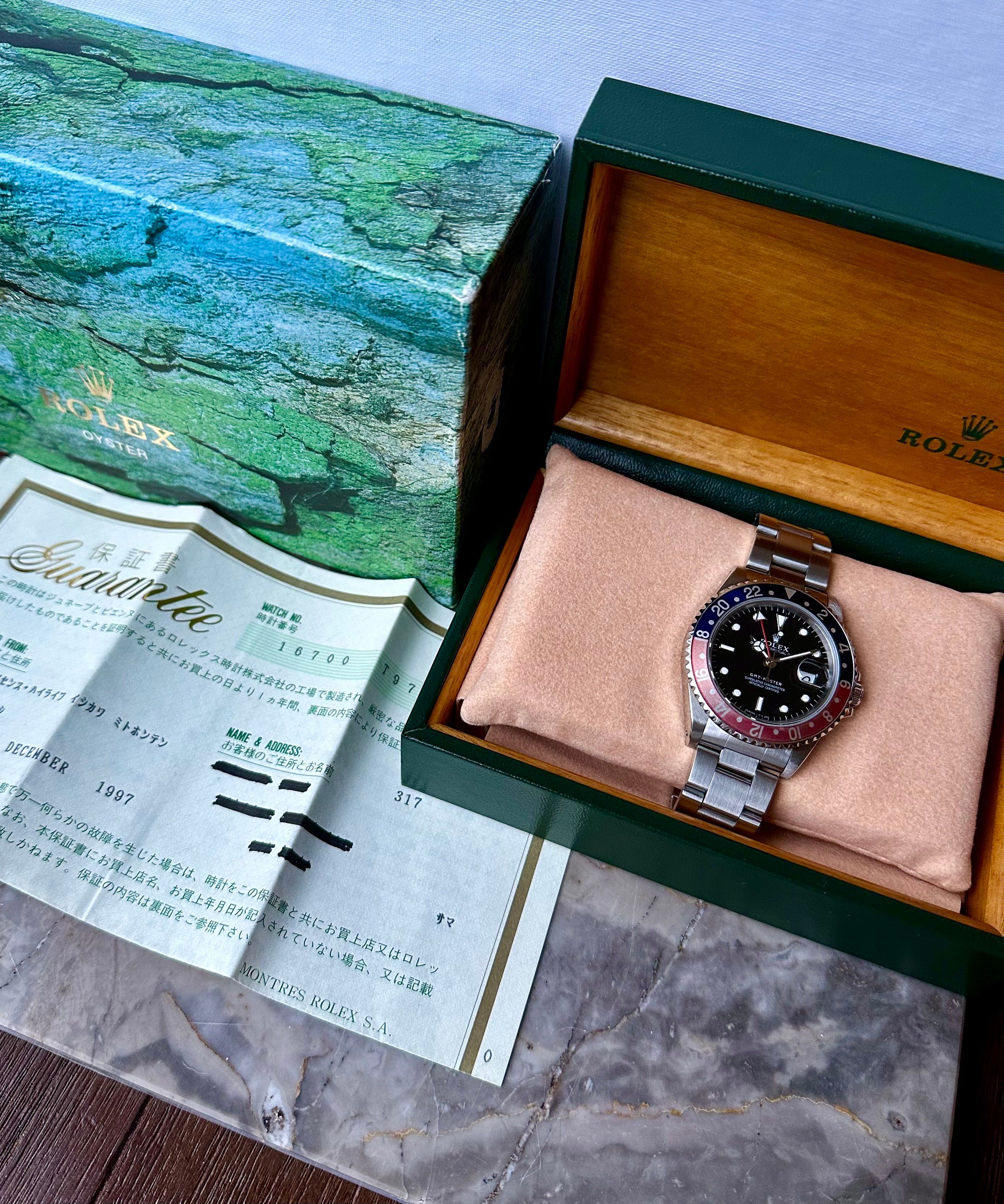 Rolex GMT Master 16700 Black 1996 with original box and papers