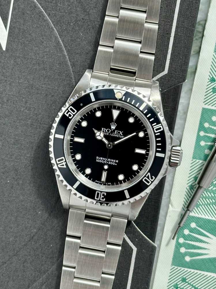 Current image for Rolex Submariner 14060 Black 1991 with original box and papers