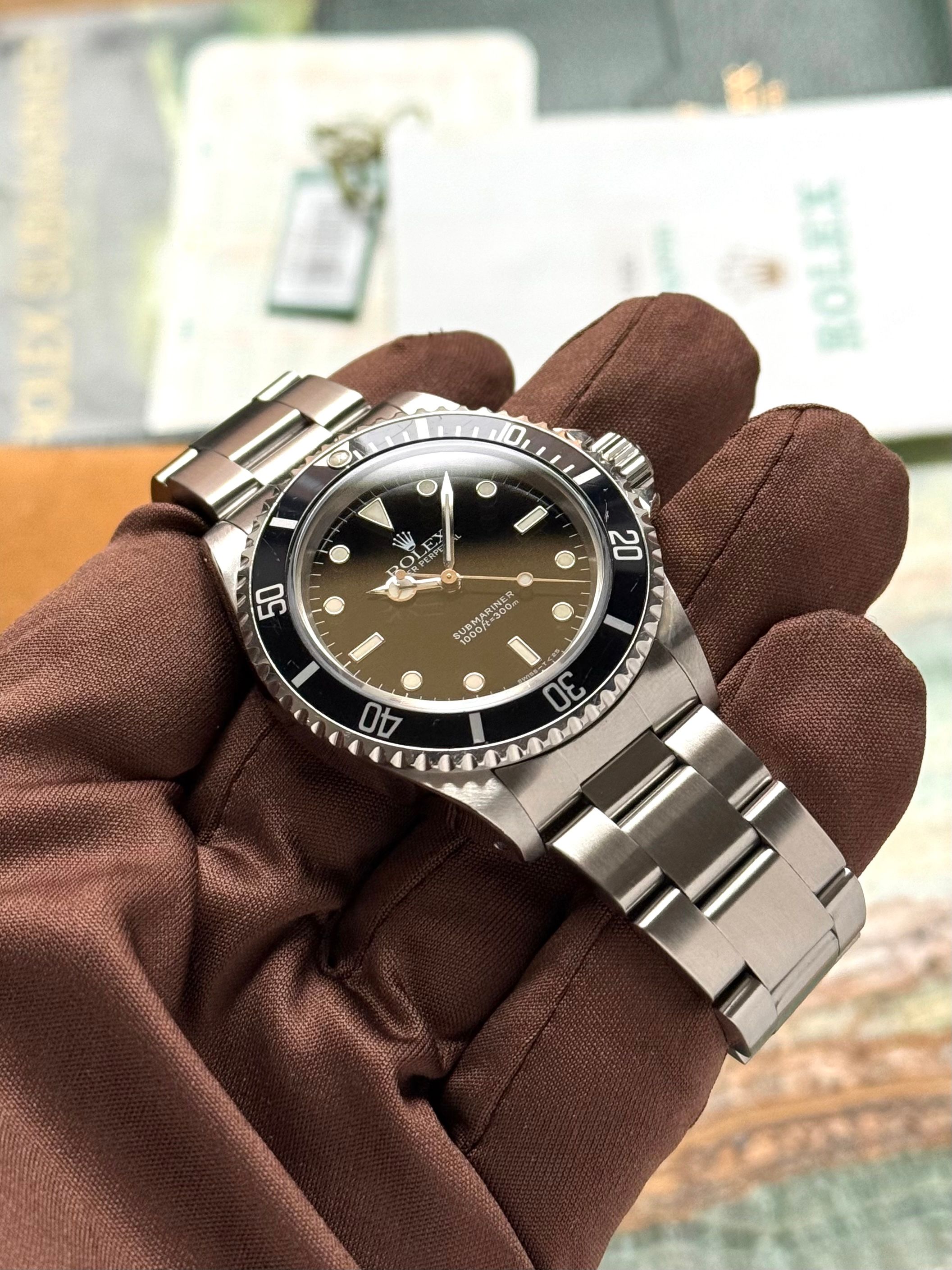 Rolex Submariner 14060 Black 1997 with original box and papers