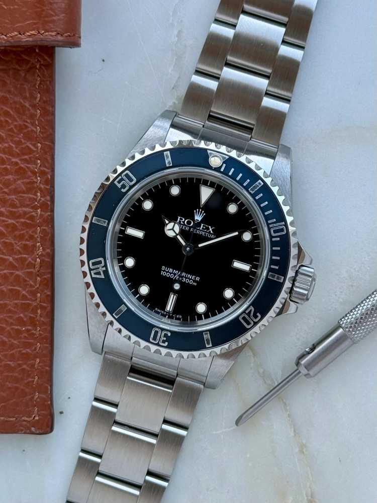 Featured image for Rolex Submariner 14060 Black 1995 with original box and papers