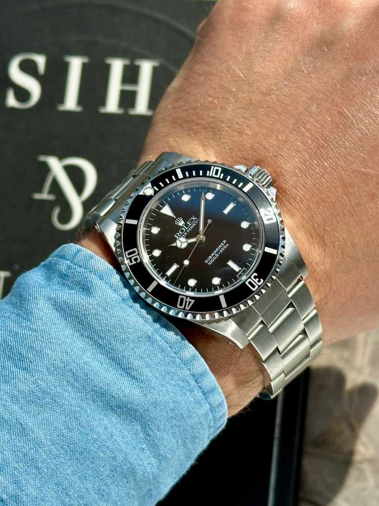 Wrist shot image for Rolex Submariner "Swiss" 14060 Black 1998 