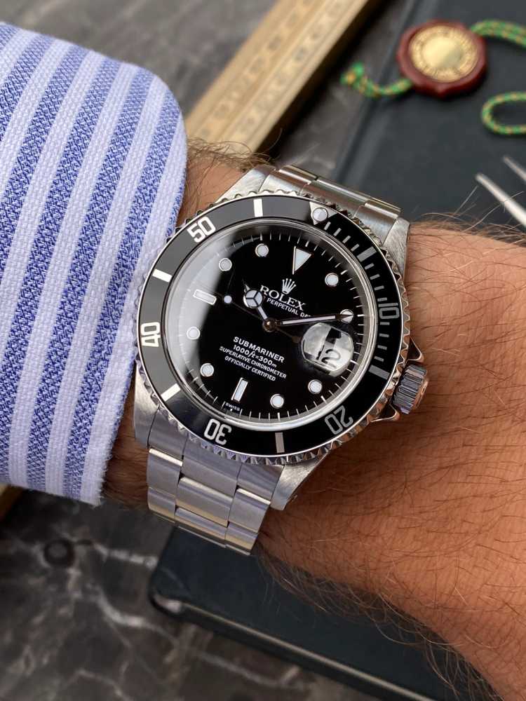 Wrist shot image for Rolex Submariner 16610 Black 1999 with original box and papers2