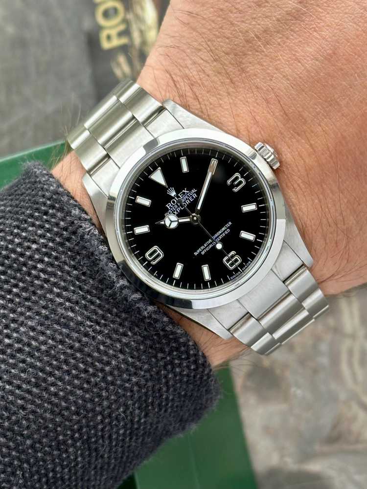 Wrist image for Rolex Explorer 1 "Engraved Rehaut" 114270 Black 2007 with original box and papers