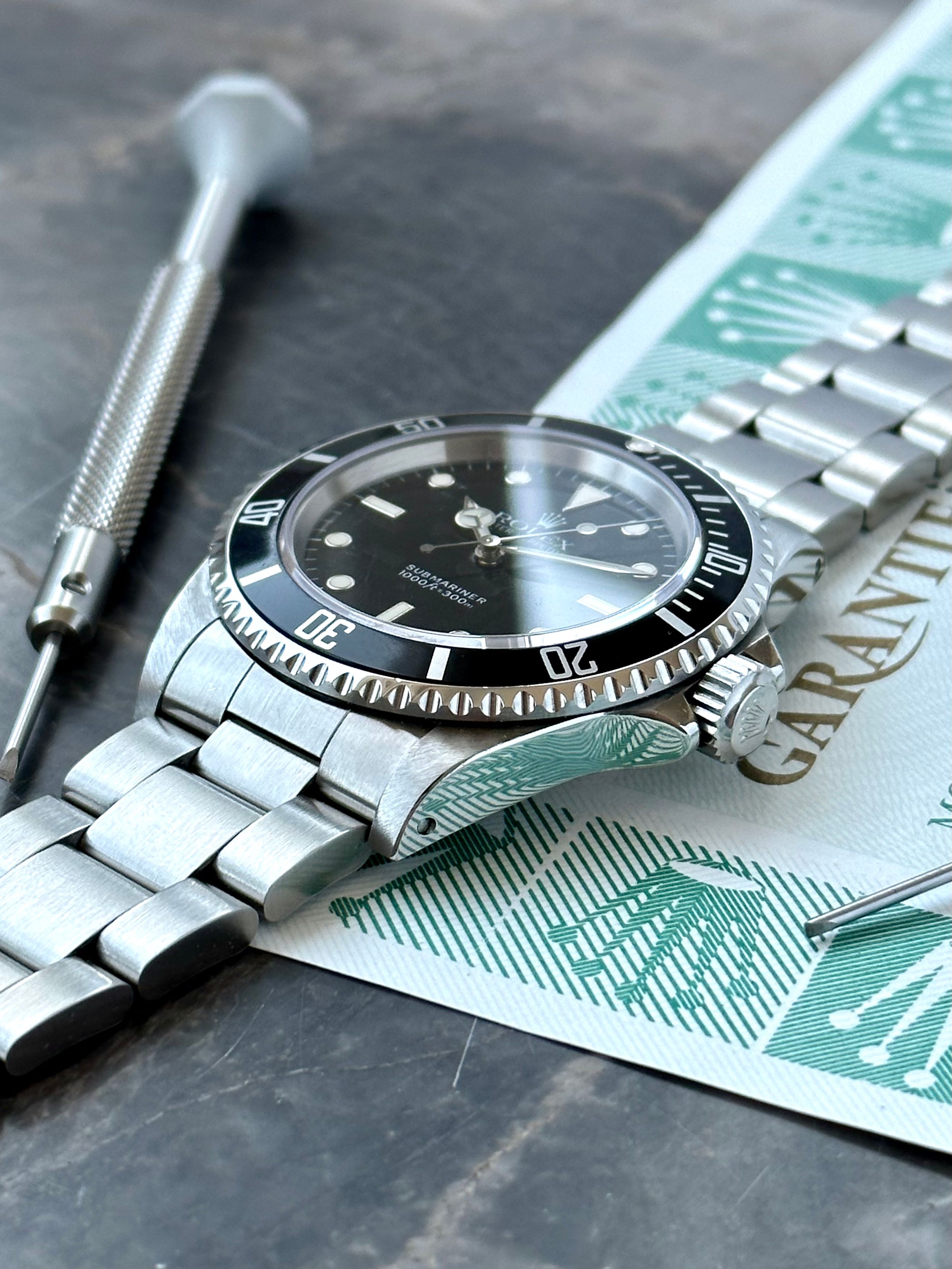 Rolex Submariner 14060 Black 1993 with original box and papers