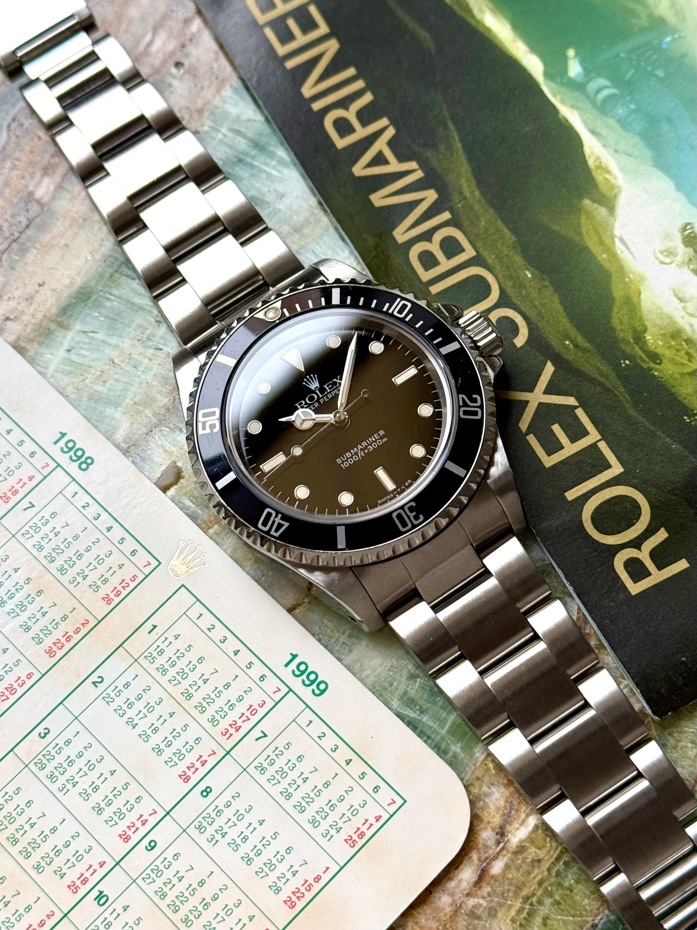 Rolex Submariner 14060 Black 1997 with original box and papers