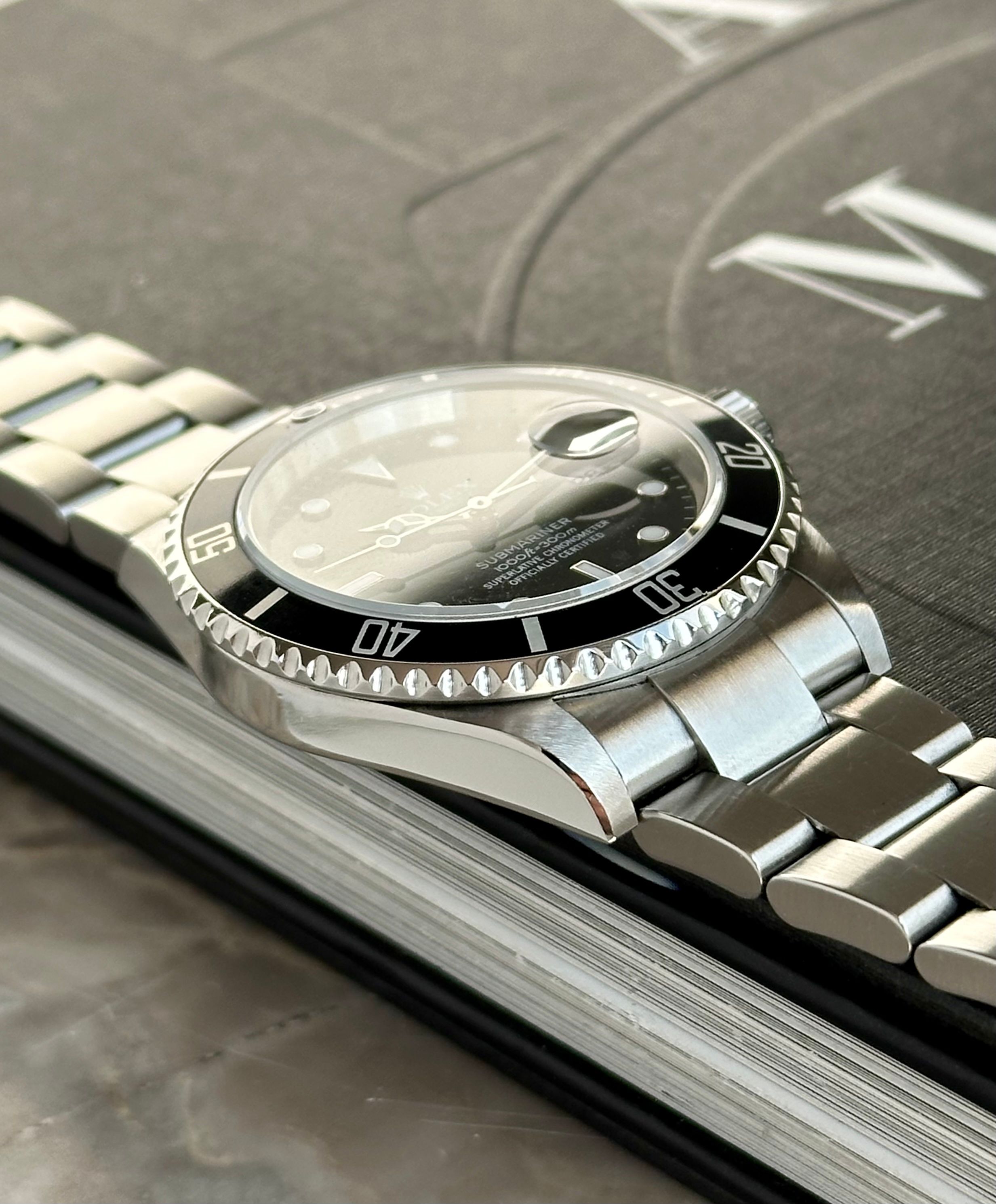 Rolex Submariner 16610 T Black 2007 with original box and papers