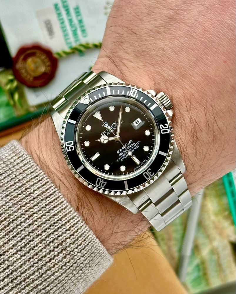 Wrist shot image for Rolex Sea-Dweller 16600 Black 1996 with original box and papers