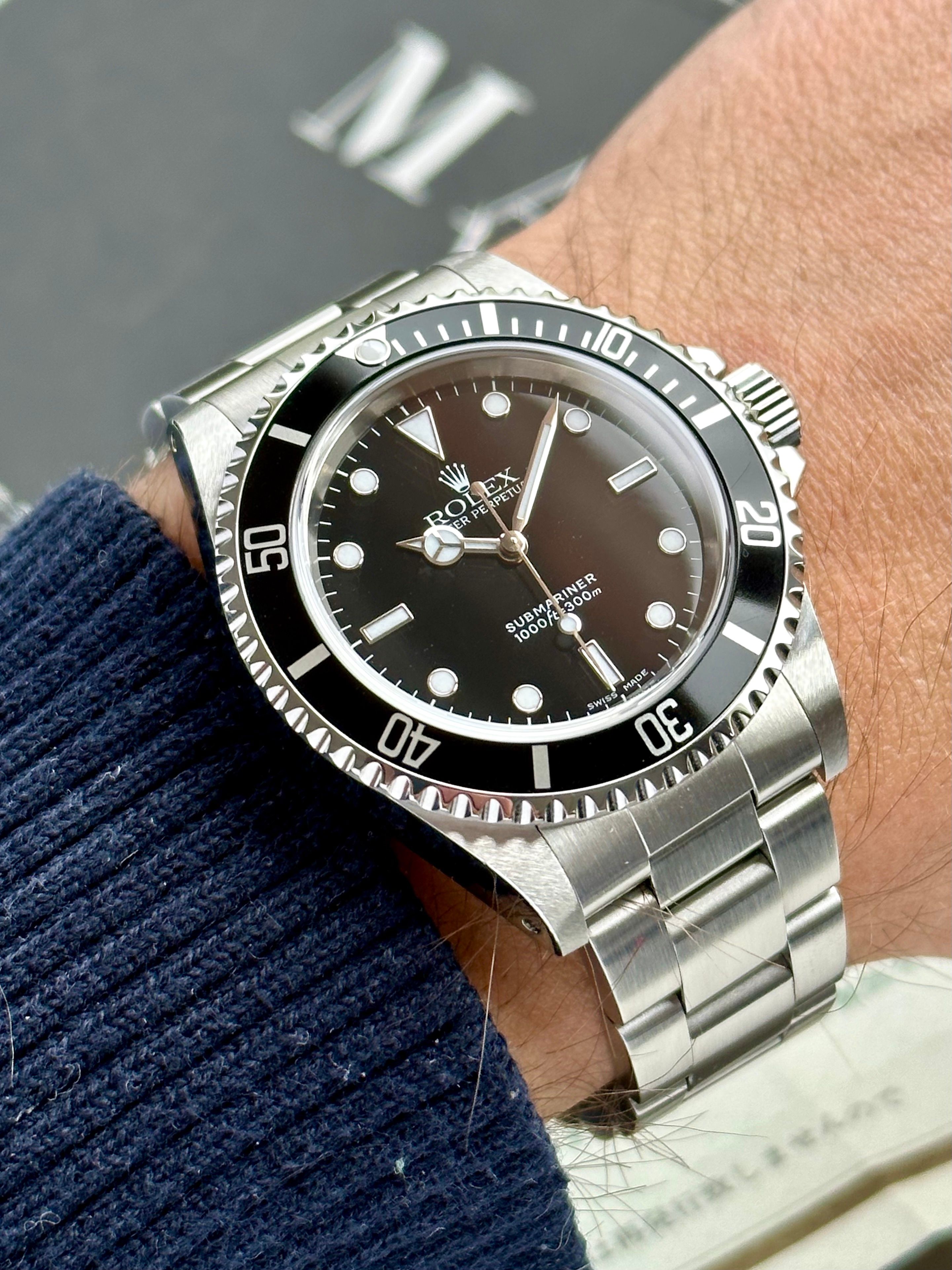 Rolex Submariner 14060 Black 2000 with original box and papers 3