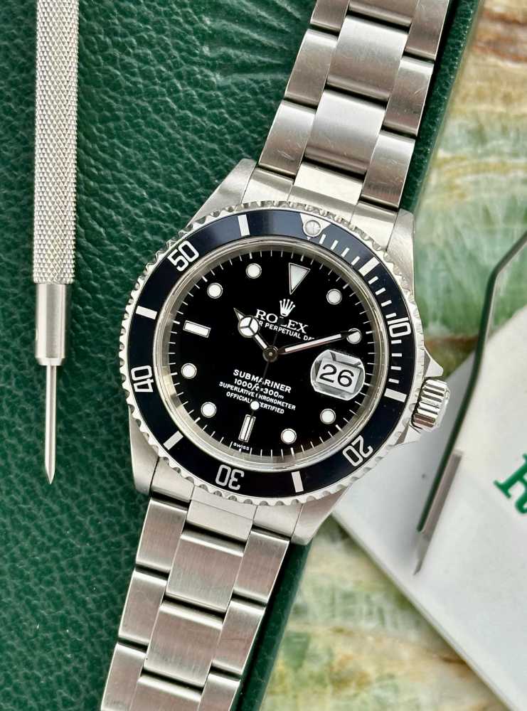 Featured image for Rolex Submariner "Swiss" 16610T Black 1999 with original box and papers