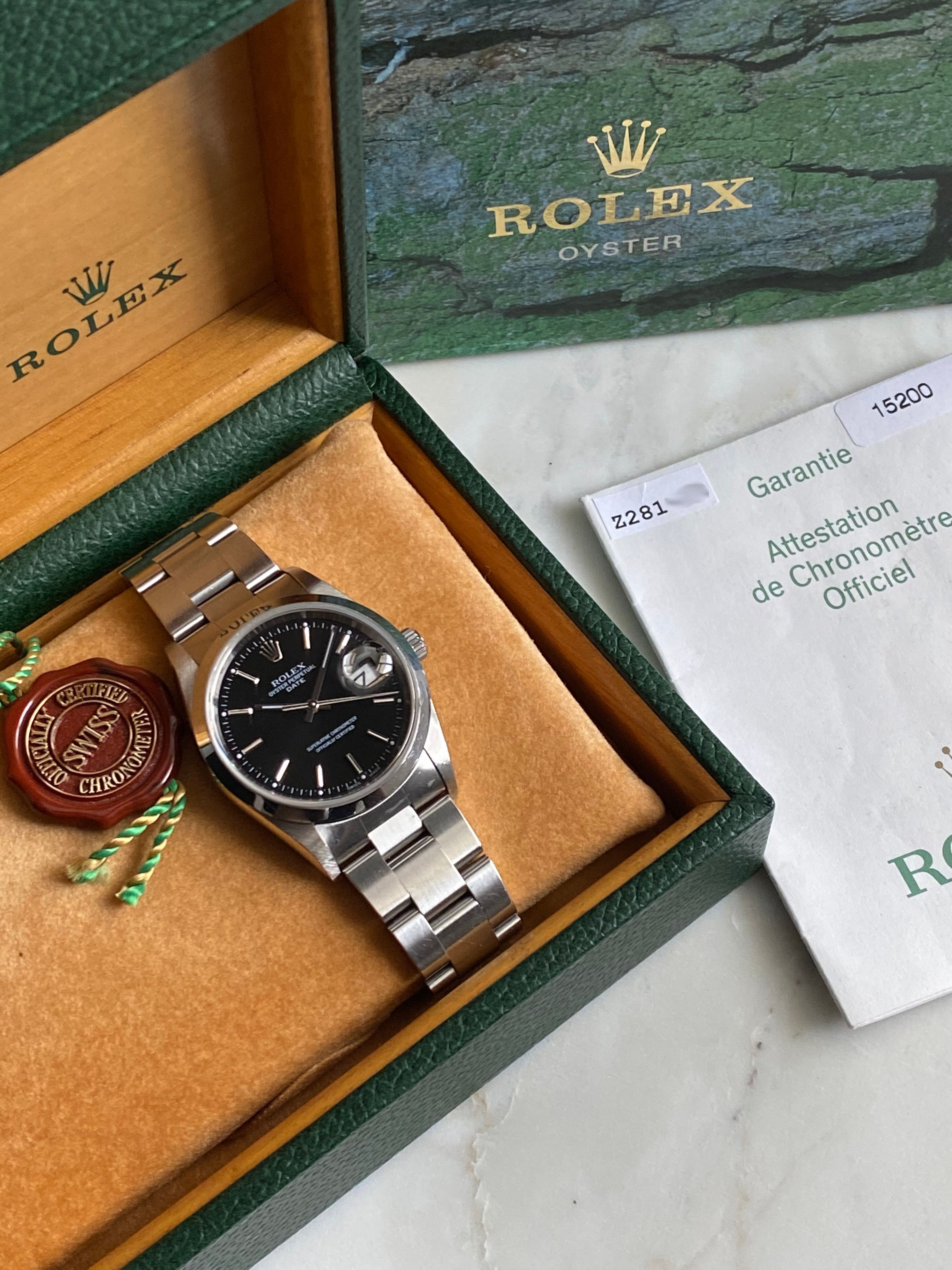 Rolex Oyster Perpetual Date 15200 Black 2005 with original box and