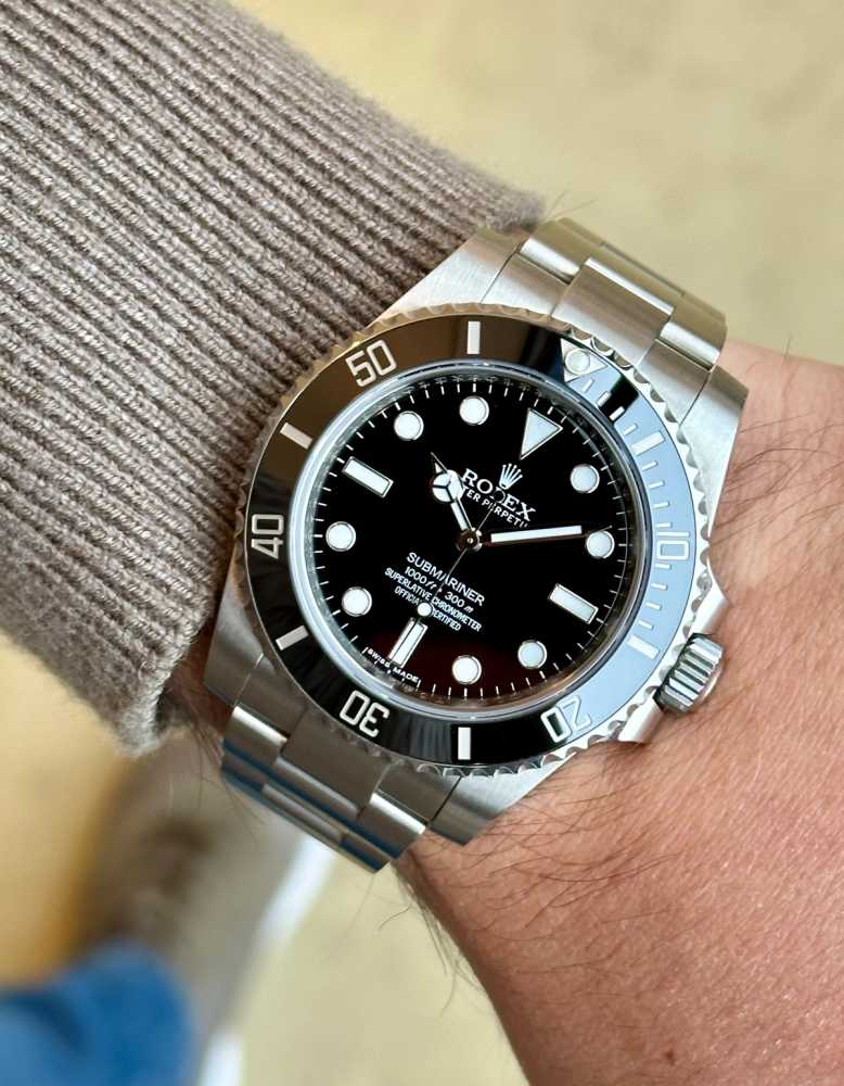 Wrist image for Rolex Submariner 114060 Black 2014 with original box and papers