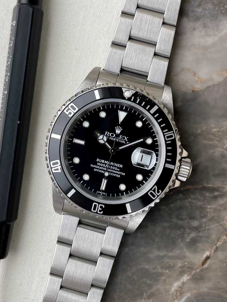 Featured image for Rolex Submariner "Swiss" 16610 Black 1997 with original box and papers