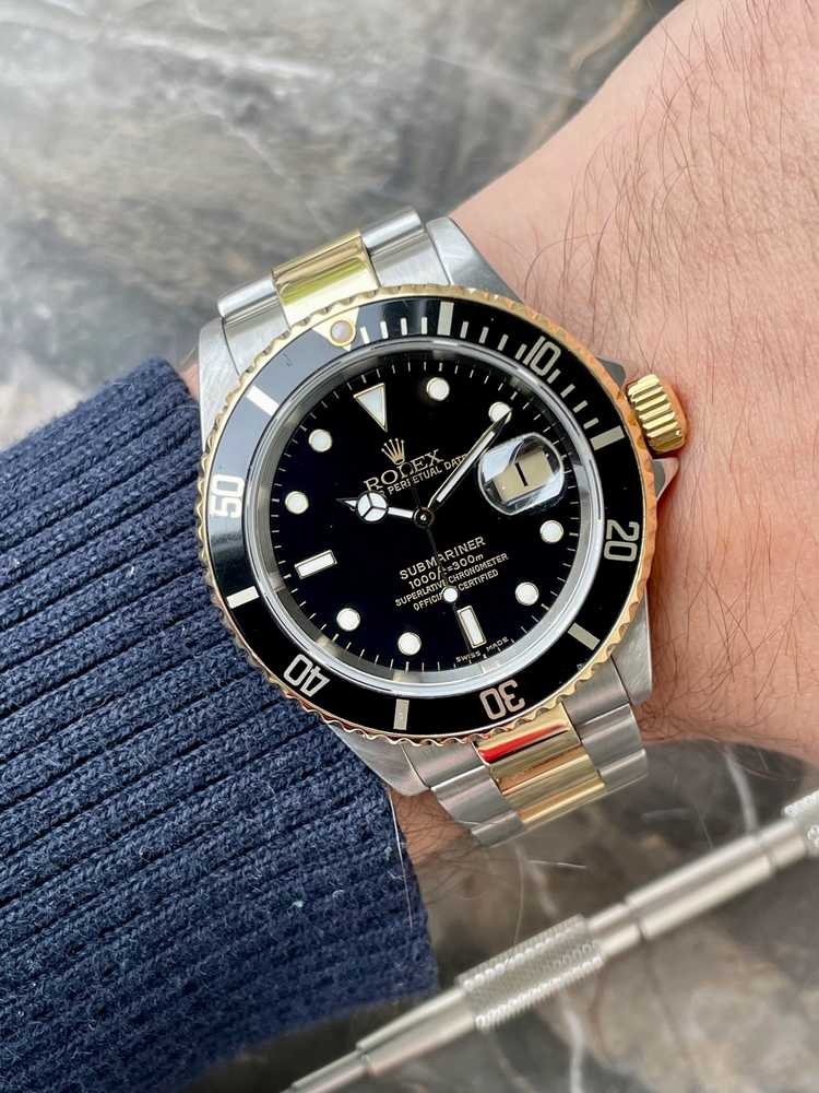 Wrist image for Rolex Submariner Date 16613 Black 2000 with original box and papers