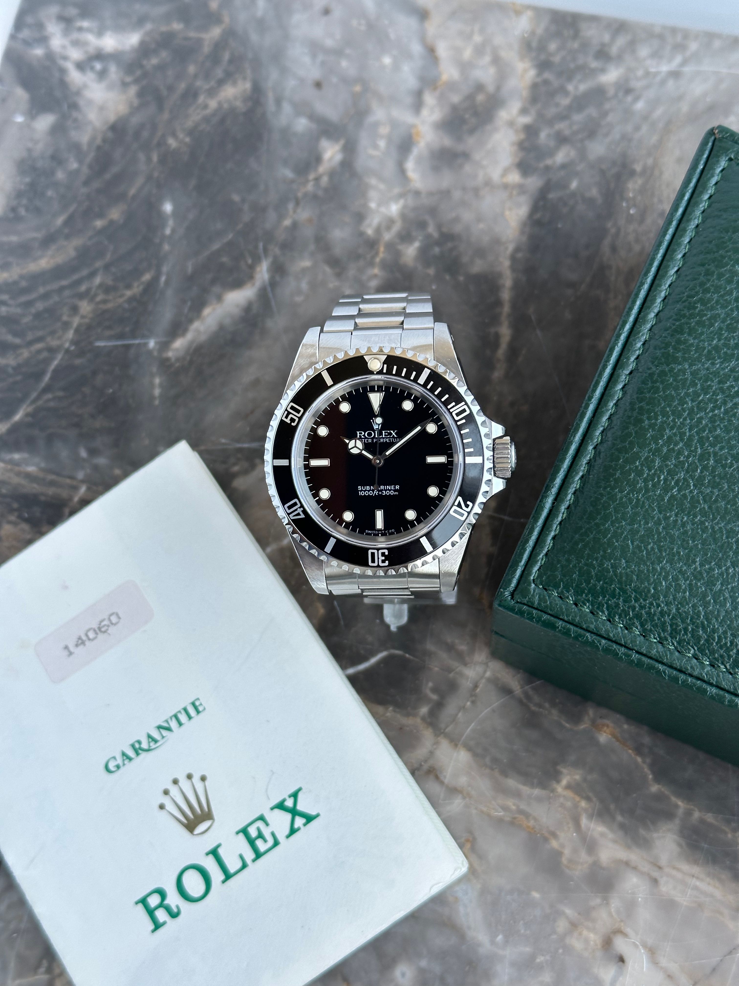 Rolex Submariner 14060 Black 1993 with original box and papers