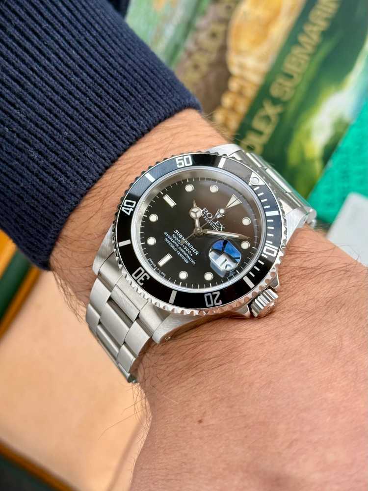 Wrist shot image for Rolex Submariner 16610 Black 1995 with original box and papers