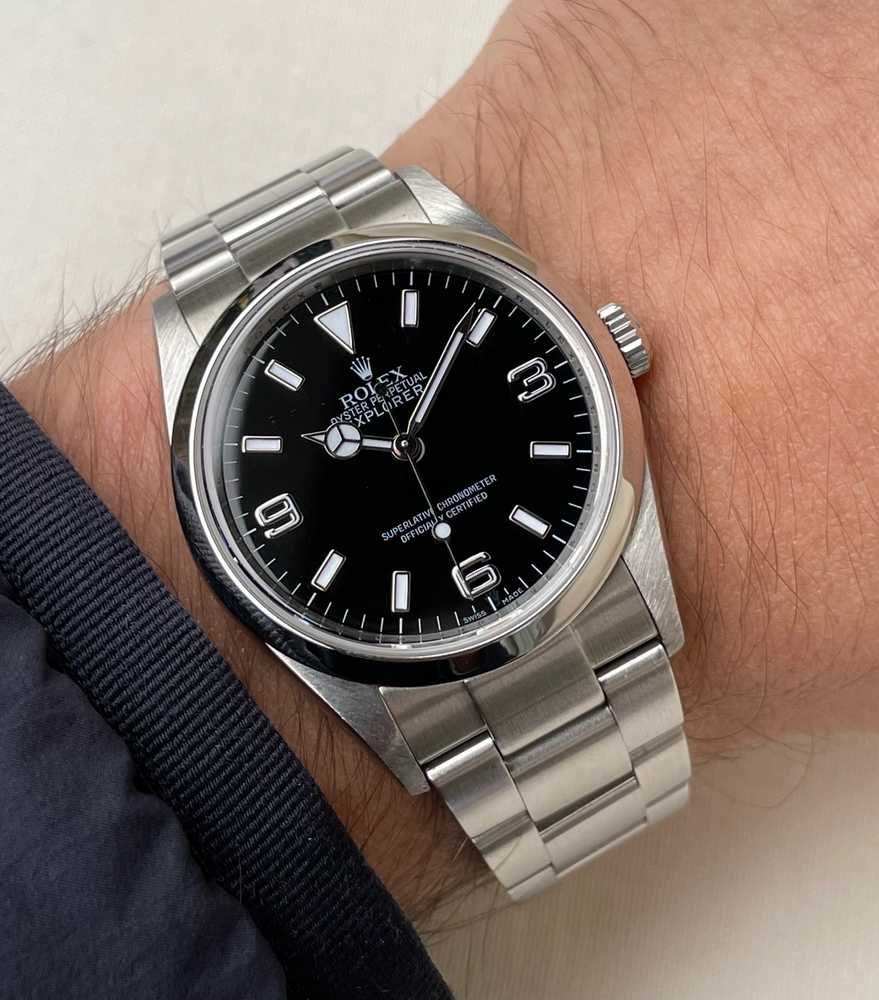 Wrist shot image for Rolex Explorer 1 "engraved rehaut" 114270 Black 2006 with original box and papers