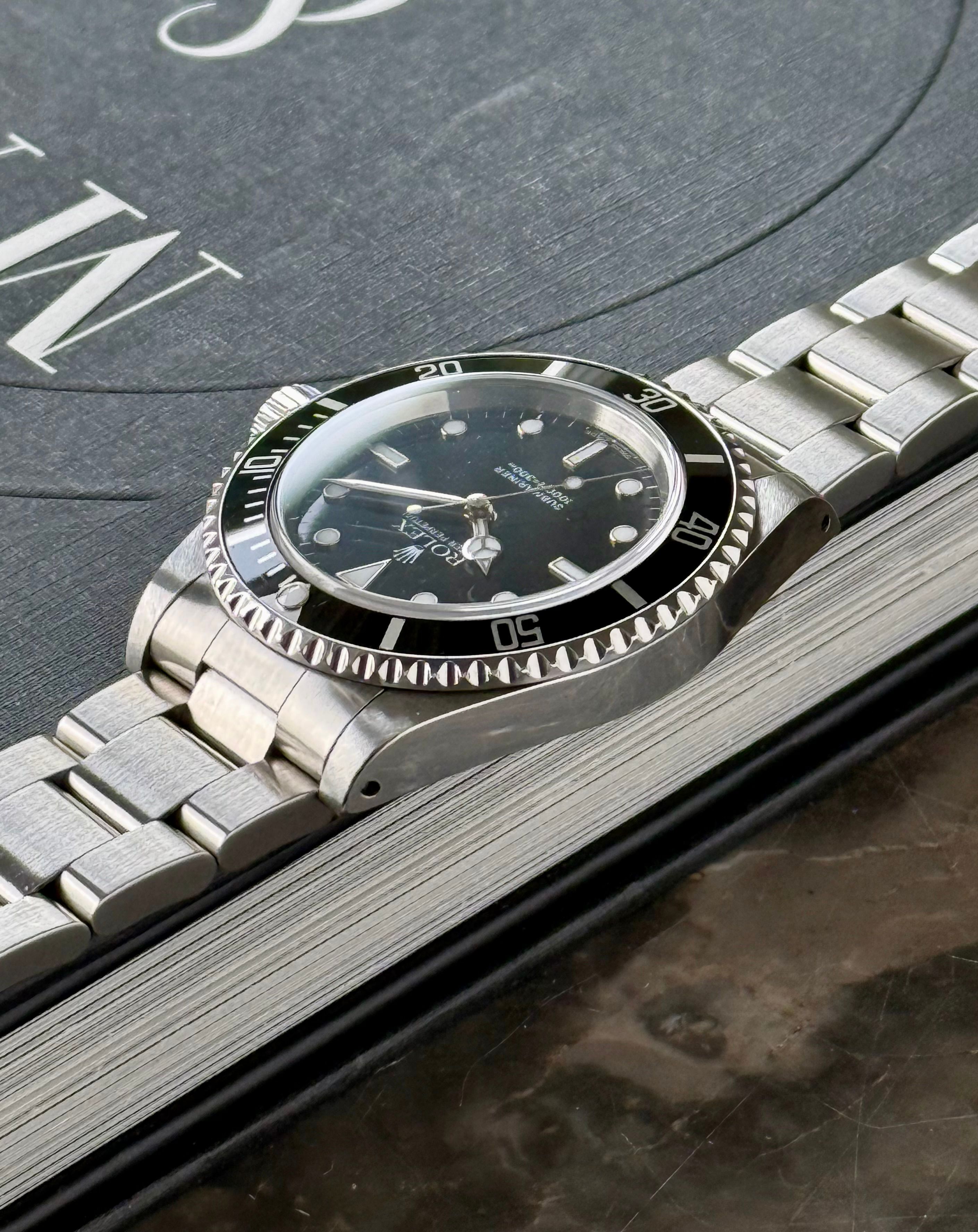 Rolex Submariner 14060 Black 2000 with original box and papers 2