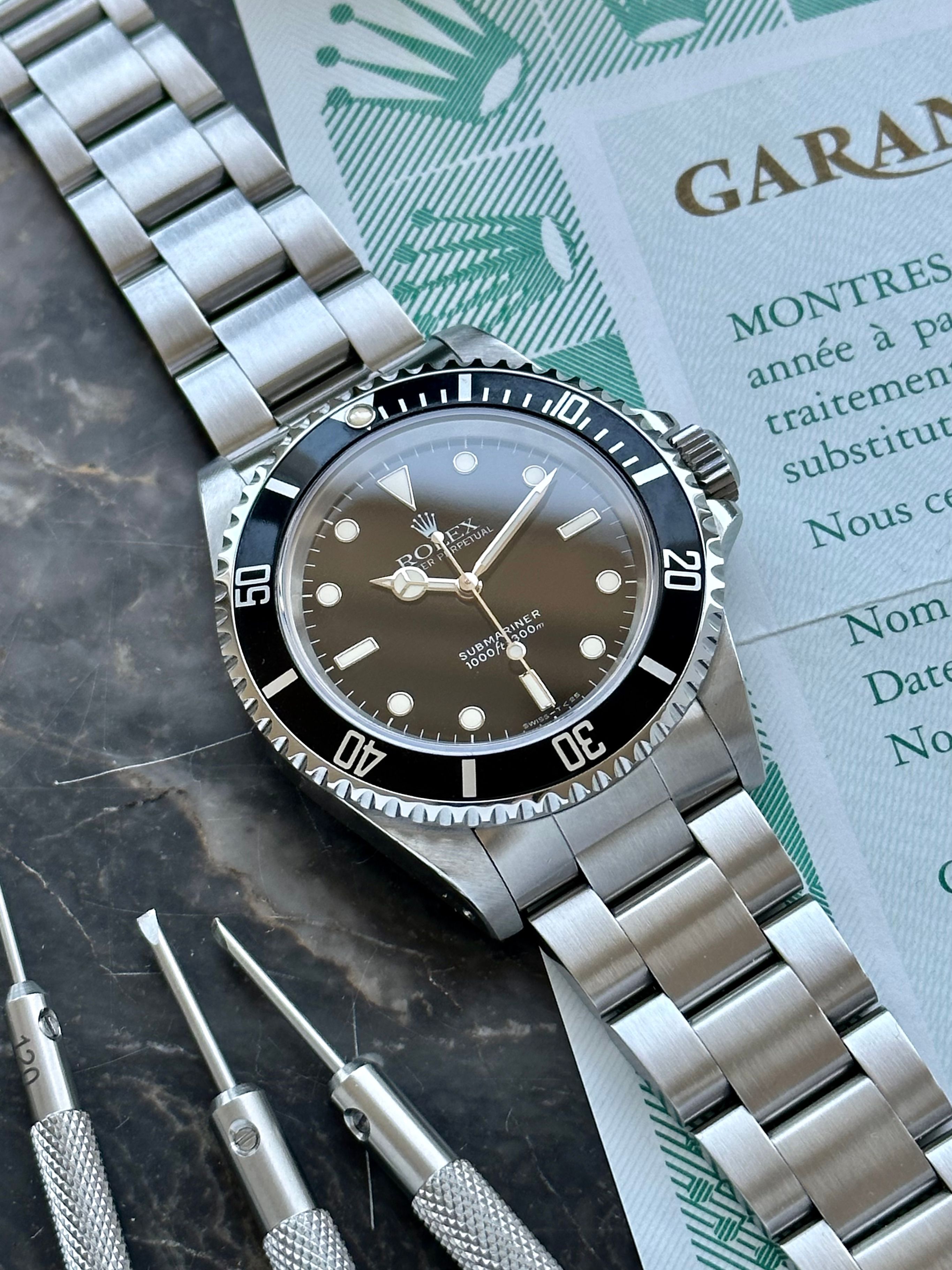 Rolex Submariner 14060 Black 1993 with original box and papers