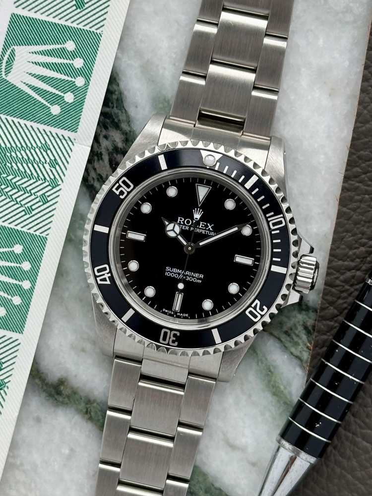 Featured image for Rolex Submariner 14060M Black 2000 with original box and papers