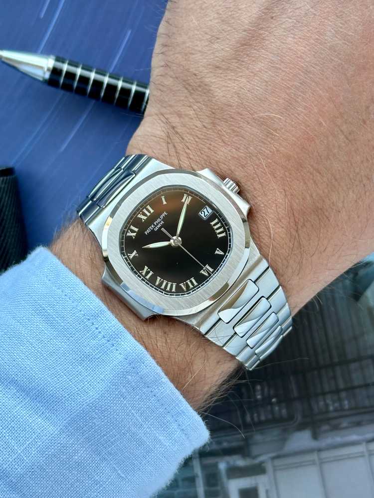 Wrist image for Patek Philippe Nautilus 3800 Black 2002 with original box and papers 2