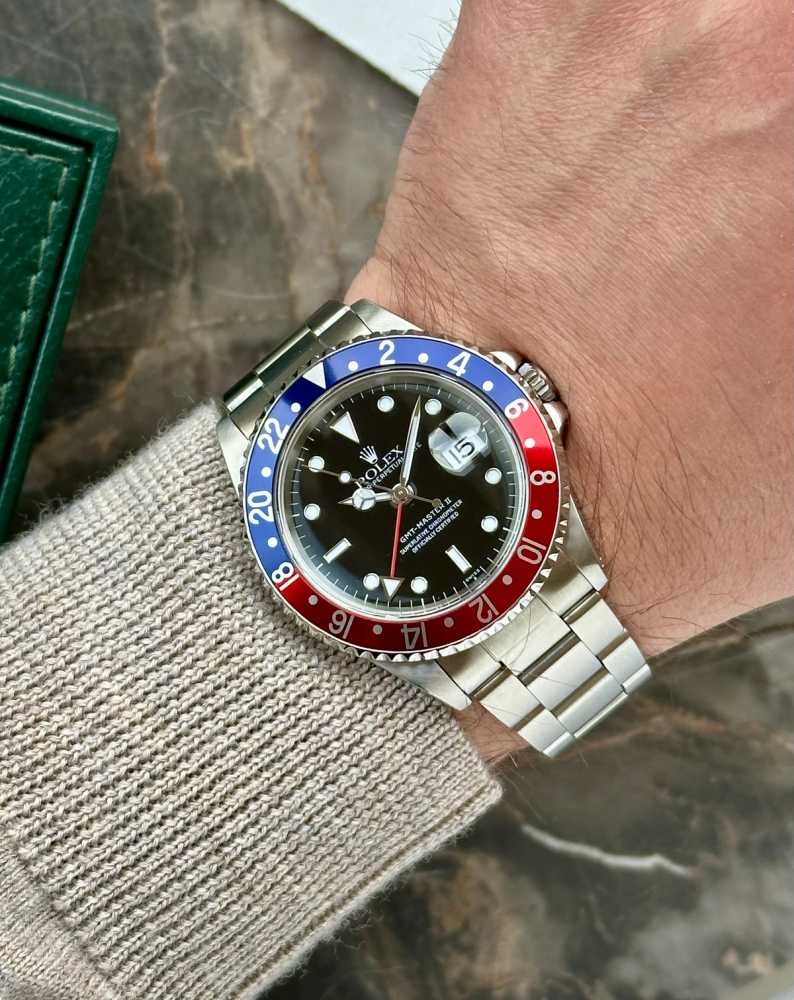 Wrist shot image for Rolex GMT-Master II "Pepsi" 16710 Black 1999 with original box and papers 2