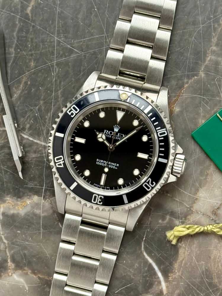 Featured image for Rolex Submariner 14060 Black 1995 with original box and papers 2