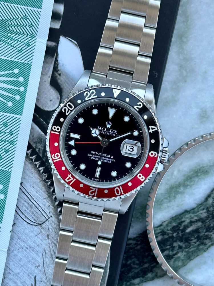 Current image for Rolex GMT-Master II "Coke / Swiss" 16710 Black 1999 with original box and papers
