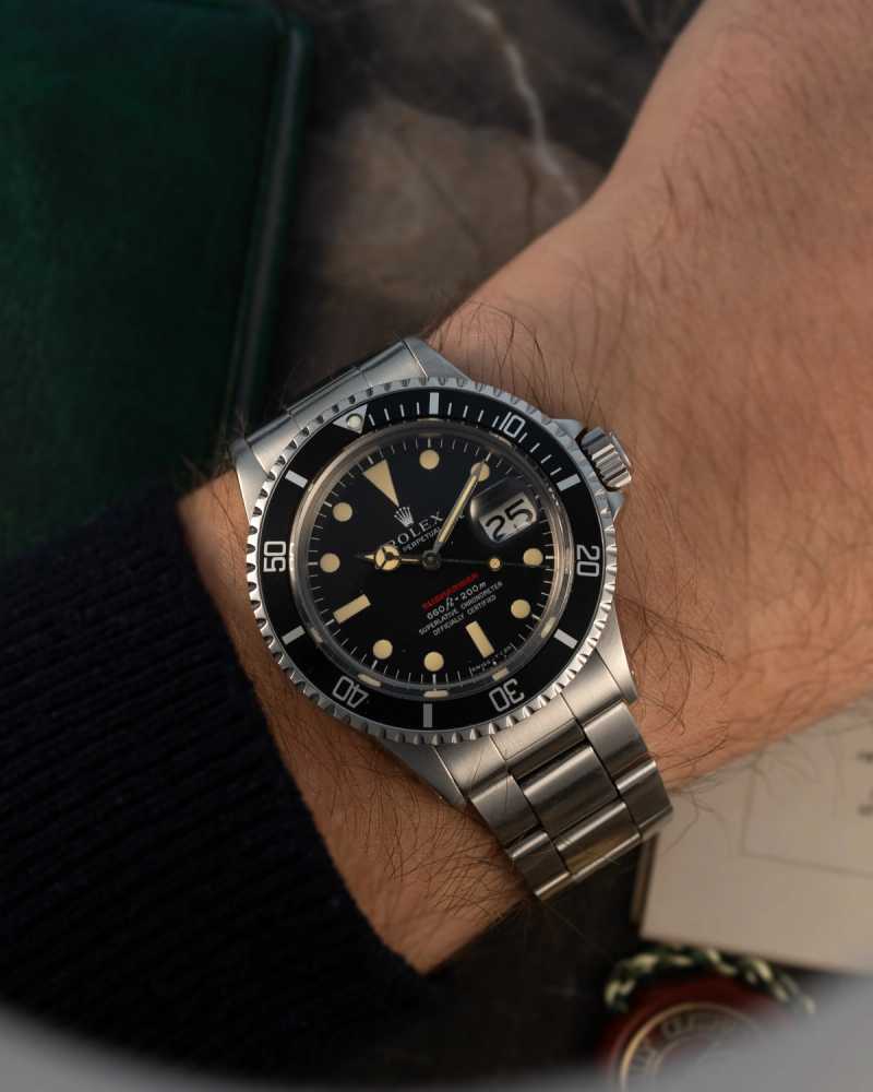 Wrist shot image for Rolex Submariner "Red" 1680 Black 1974 with original box and papers
