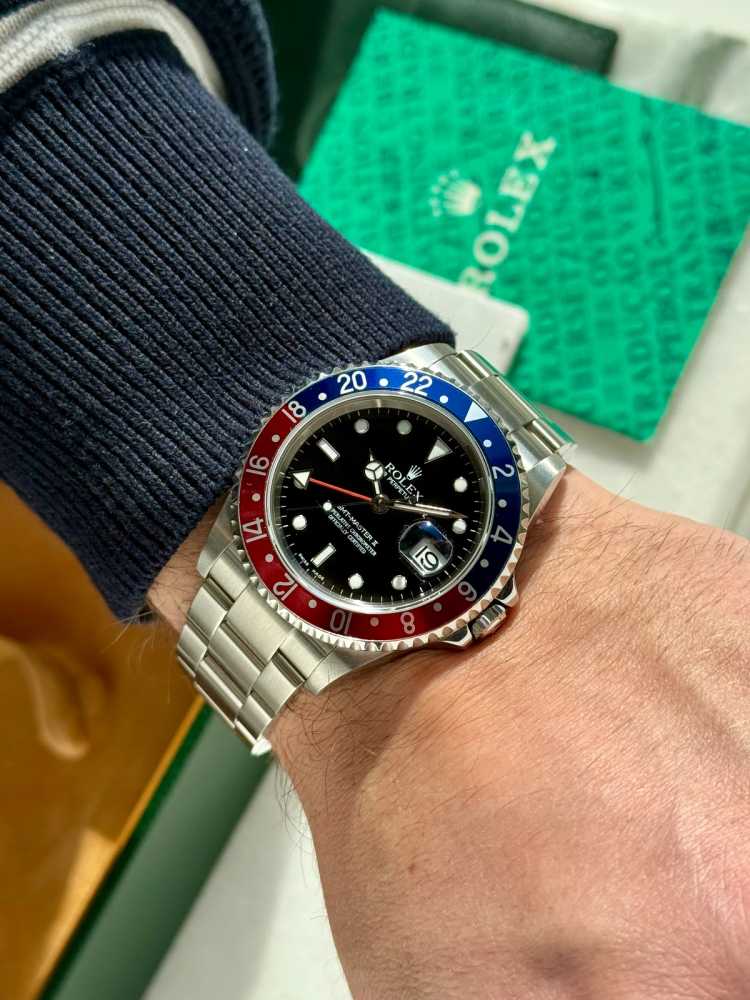 Wrist shot image for Rolex GMT-Master II "Pepsi" 16710 T Black 2005 with original box and papers