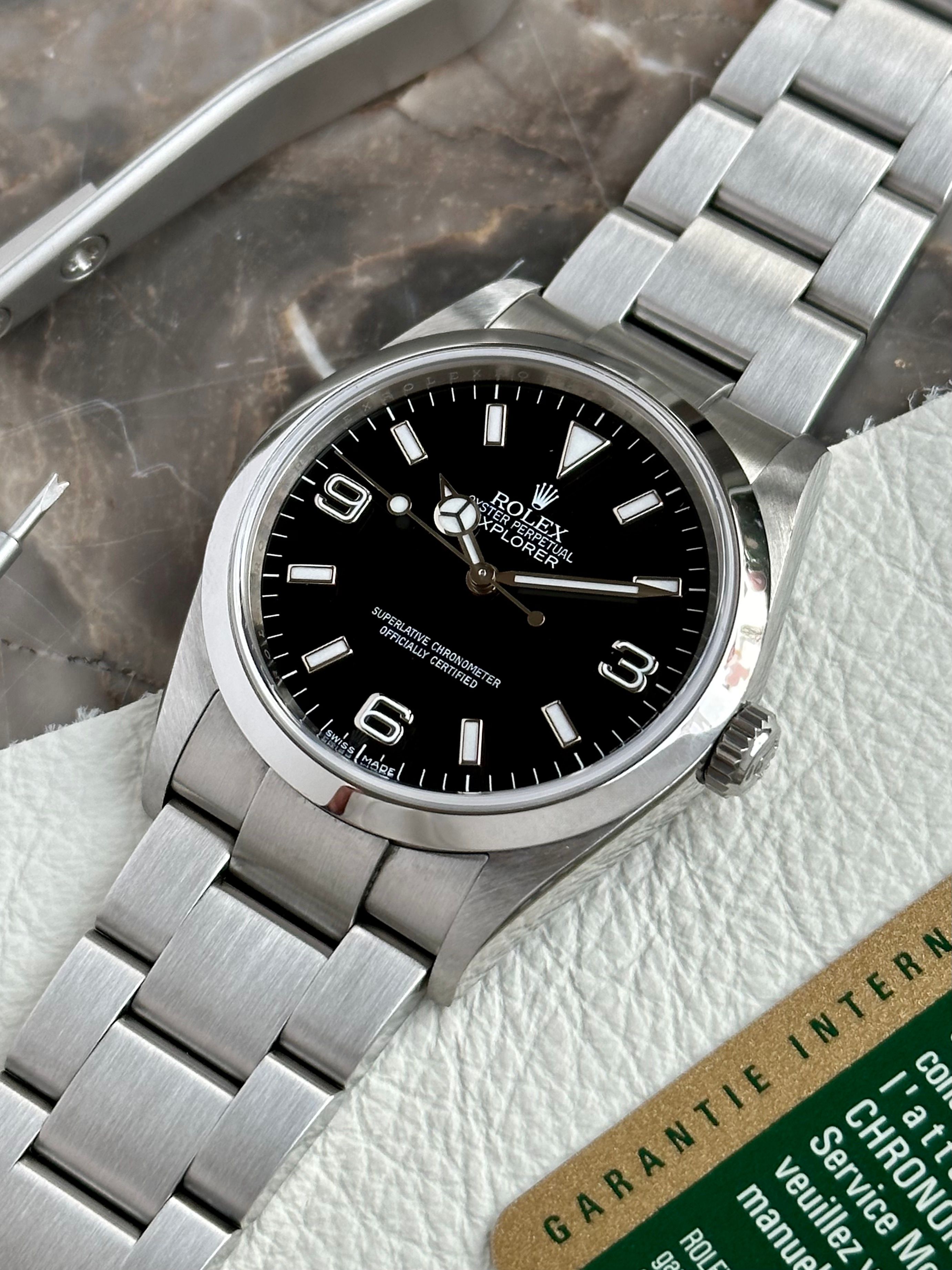 Rolex Explorer 114270 Black 2009 with original box and papers