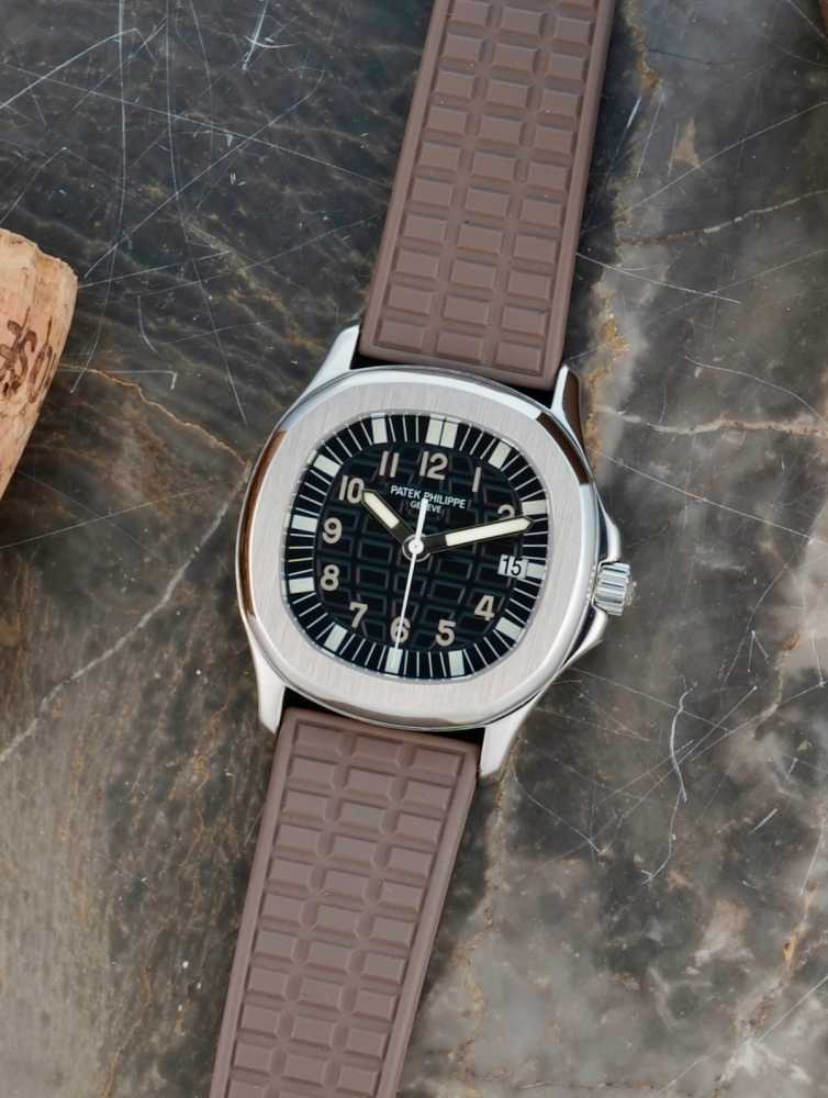 Featured image for Patek Philippe Aquanaut "PATEK SERVICE" 5064A Black 2003 with original box and papers