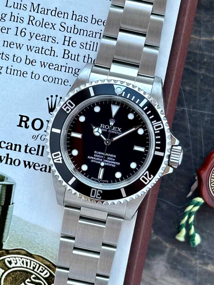 Featured image for Rolex Submariner 14060M Black 2009 with original box and papers
