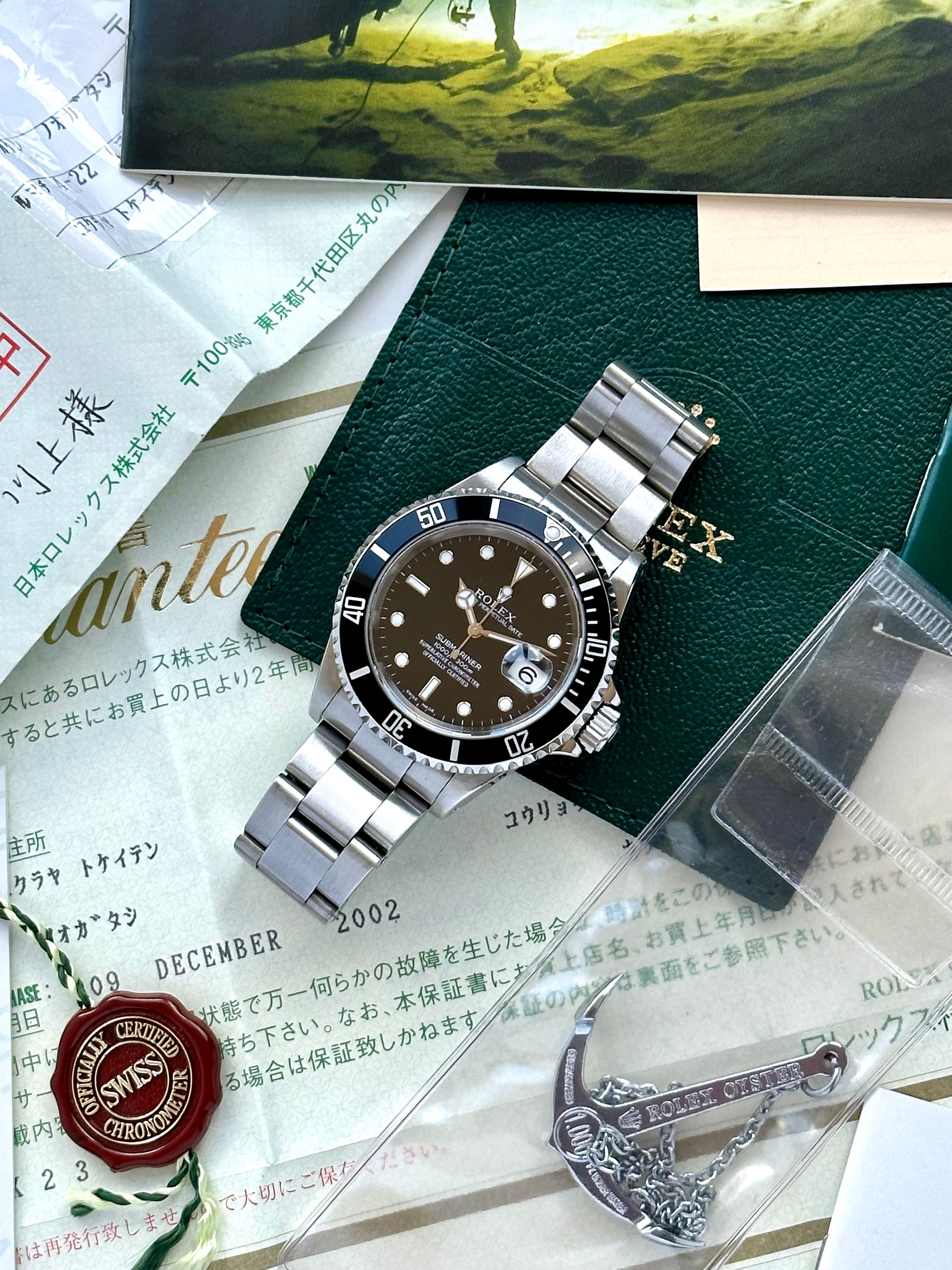 Rolex Submariner 16610 Black 2002 with original box and papers