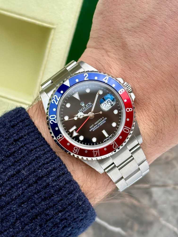 Wrist shot image for Rolex GMT-Master II "Pepsi" 16710 T Black 2006 with original box and papers