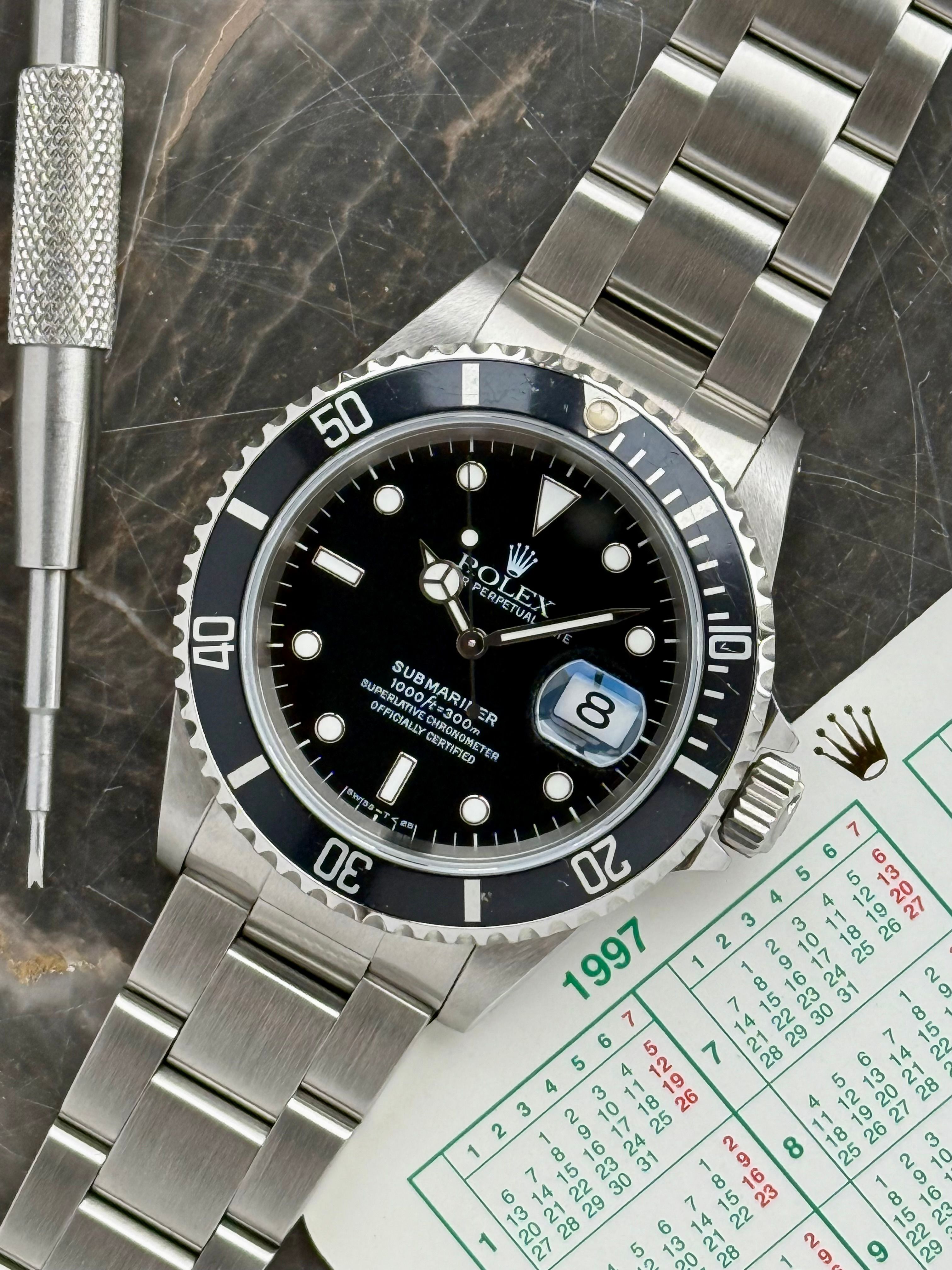 Rolex Submariner 16610 Black 1997 with original box and papers