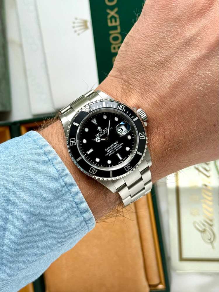 Wrist shot image for Rolex Submariner 16610 Black 2000 with original box and papers 3