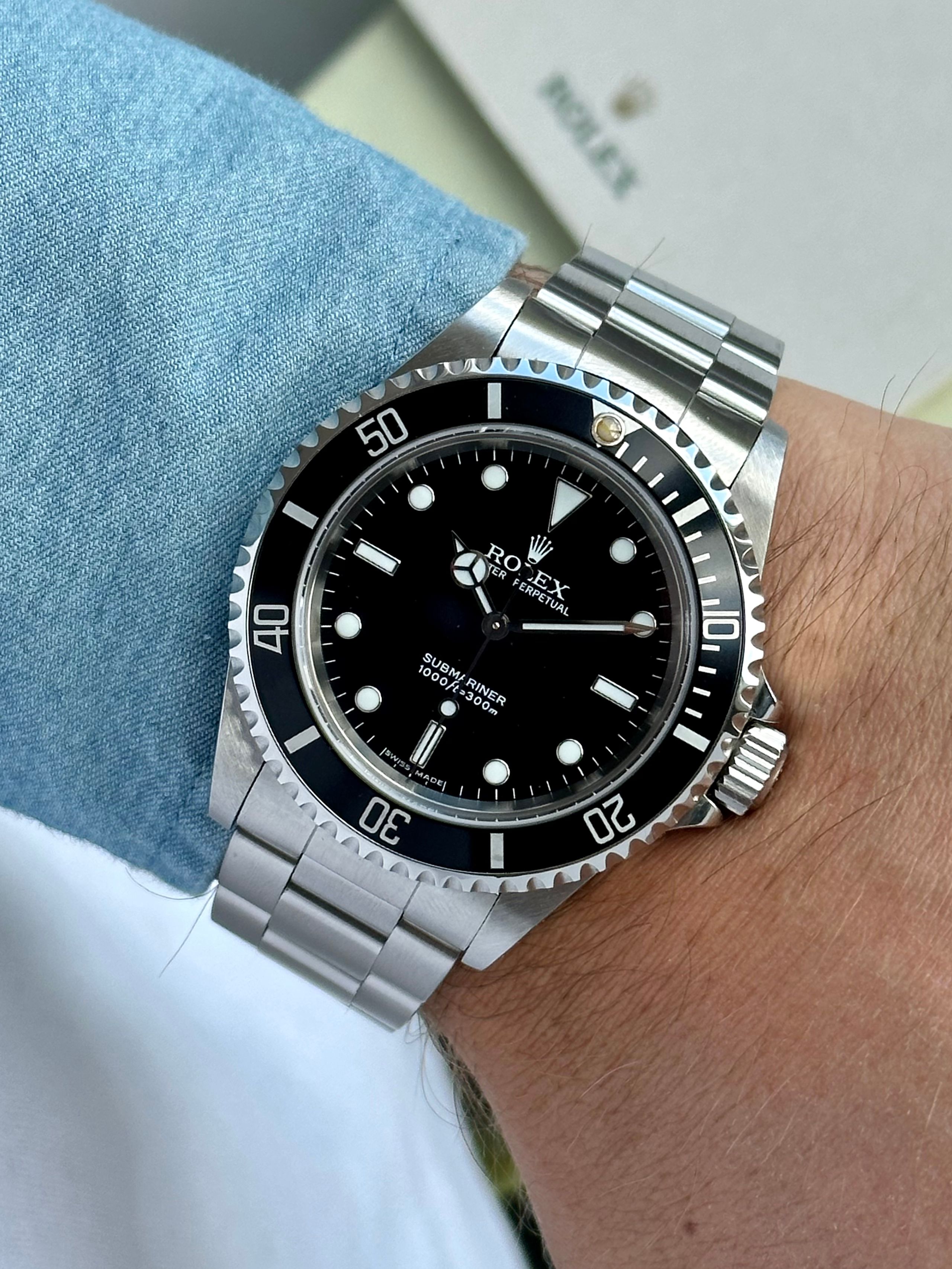 Rolex Submariner 14060M Black 2005 with original box and papers