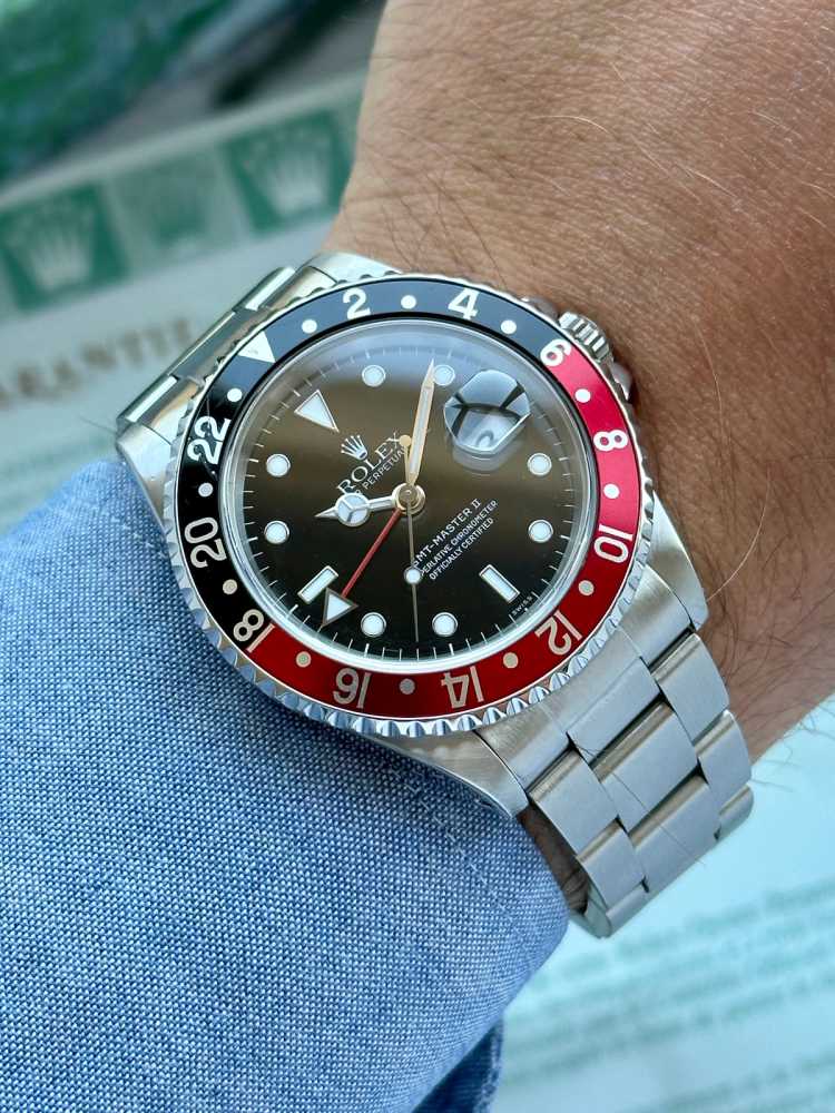 Wrist image for Rolex GMT-Master II "Coke / Swiss" 16710 Black 1999 with original box and papers