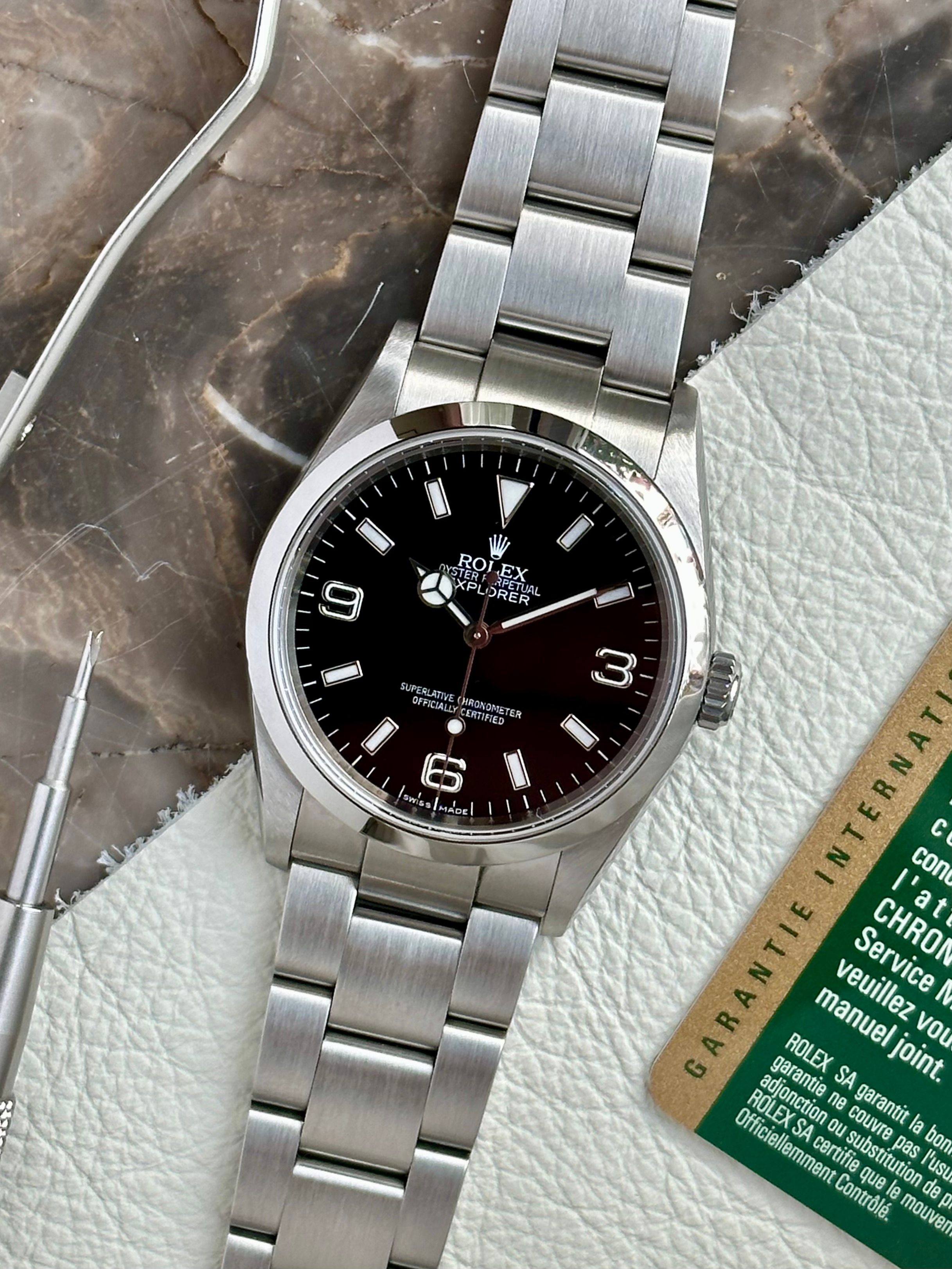 Rolex Explorer 114270 Black 2009 with original box and papers