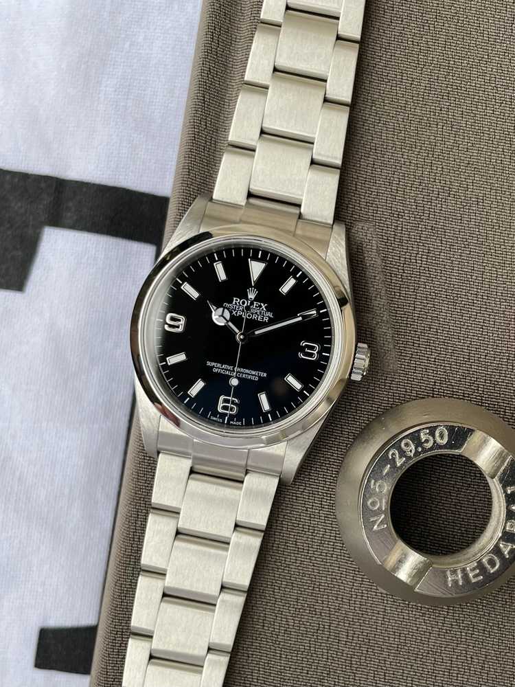 Featured image for Rolex Explorer 1 "engraved rehaut" 114270 Black 2007 with original box and papers
