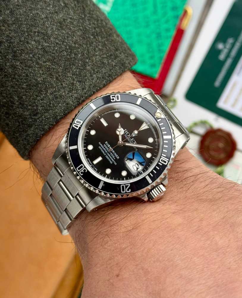 Wrist shot image for Rolex Submariner 16610 Black 1997 with original box and papers