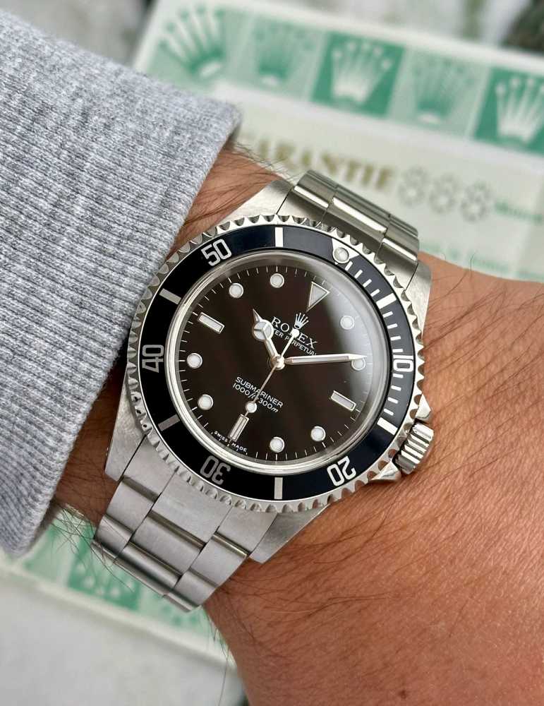 Wrist shot image for Rolex Submariner 14060M Black 2000 with original box and papers