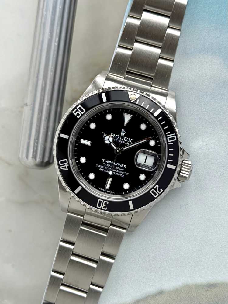 Featured image for Rolex Submariner "Rolex Warranty" 16610 Black 1989 with original box and papers