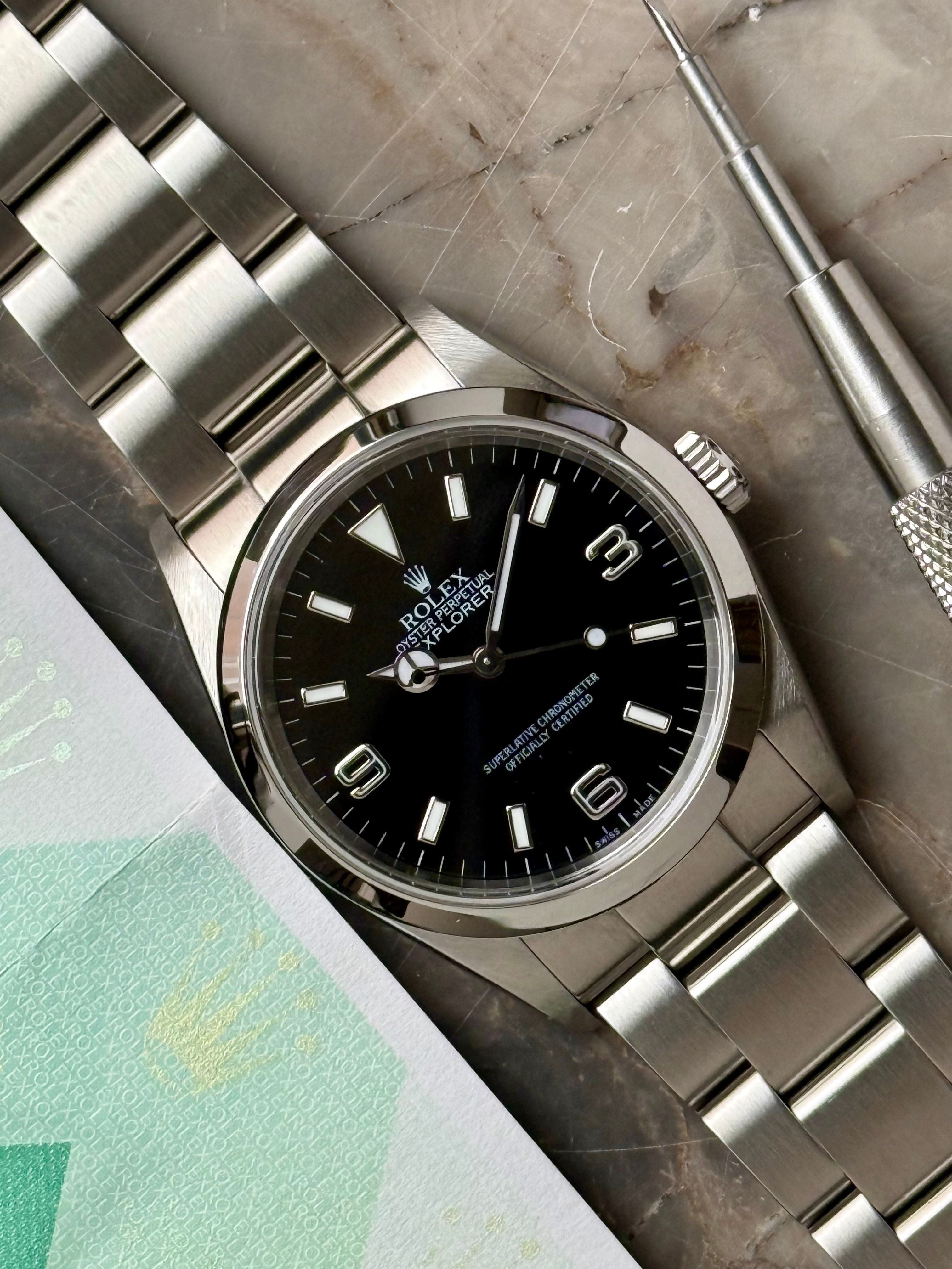 Rolex Explorer 114270 Black 2004 with original box and papers