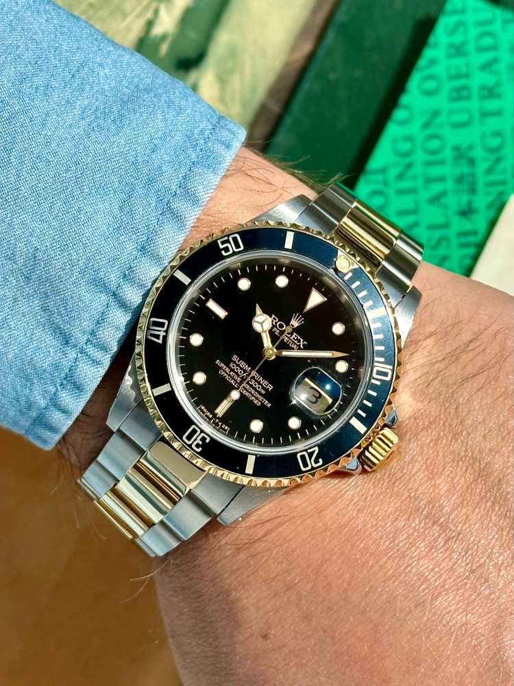 Wrist shot image for Rolex Submariner  16613 Black 1991 with original box and papers