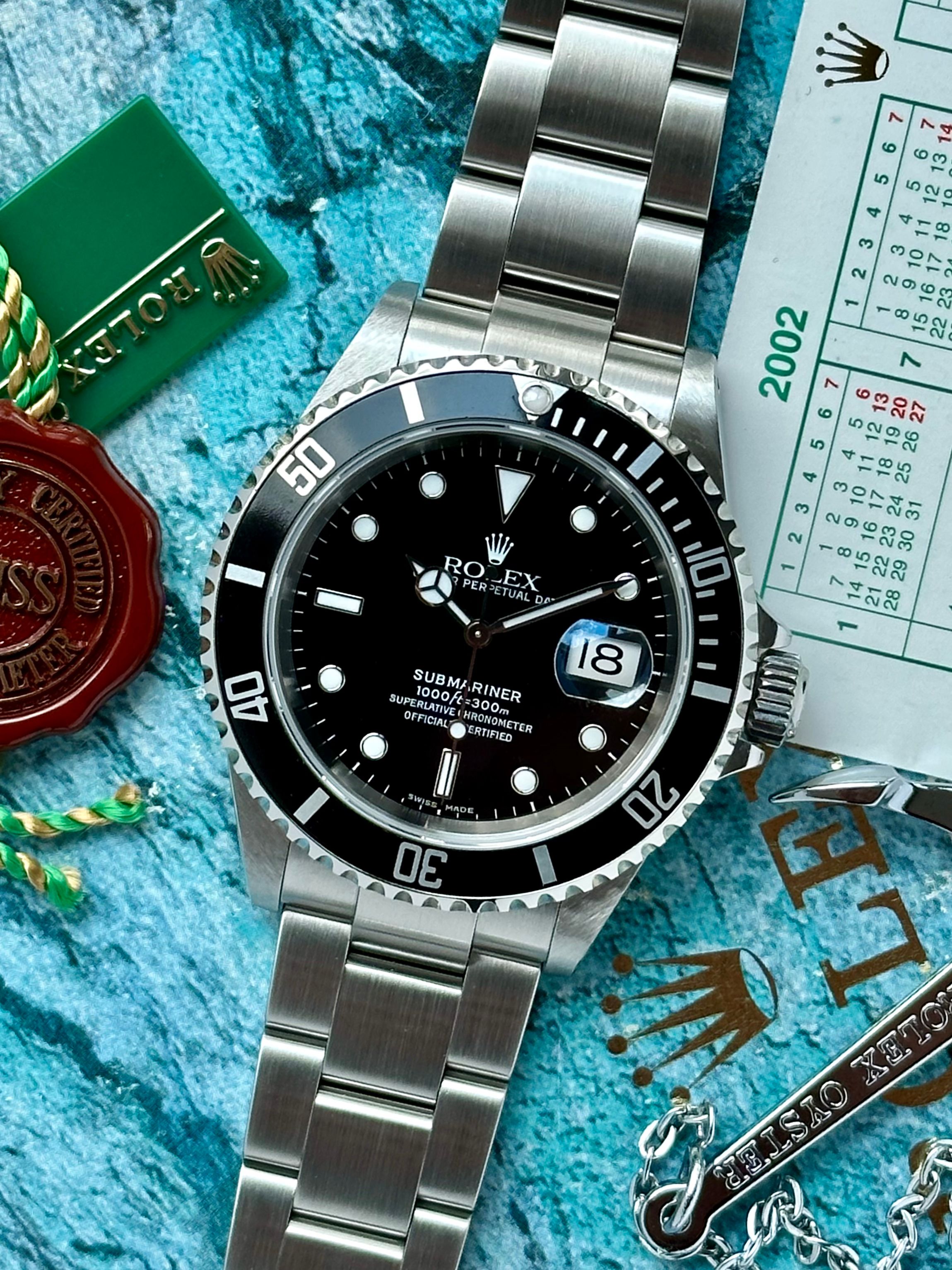 Rolex Submariner 16610 Black 2002 with original box and papers 2