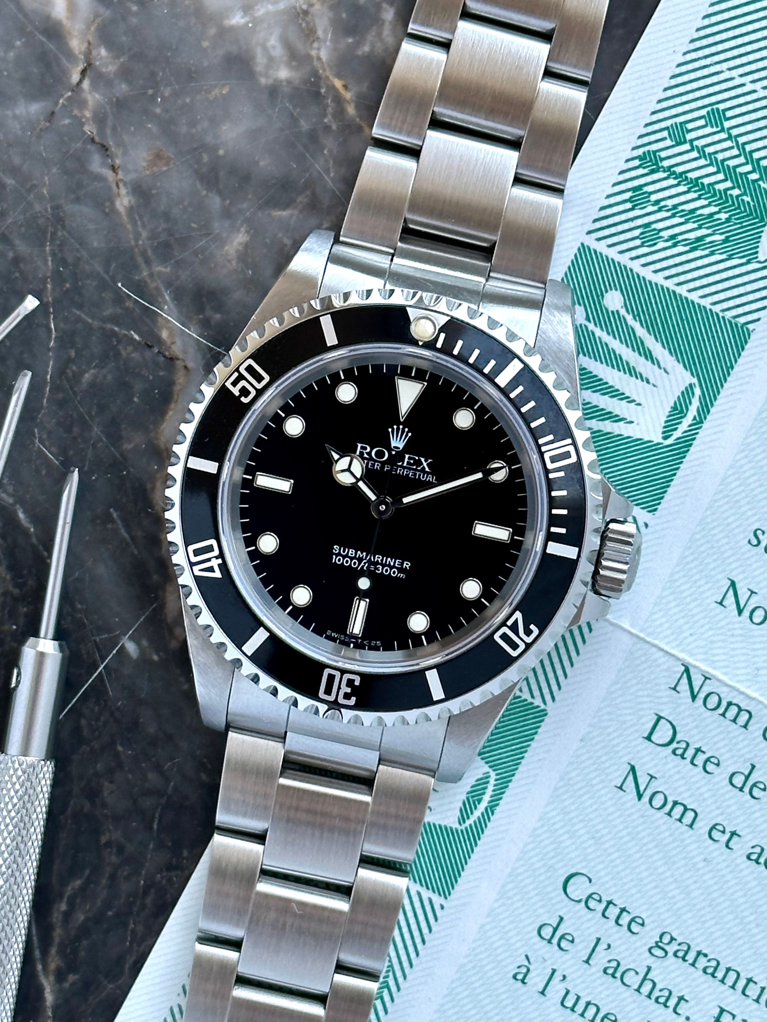 Rolex Submariner 14060 Black 1993 with original box and papers