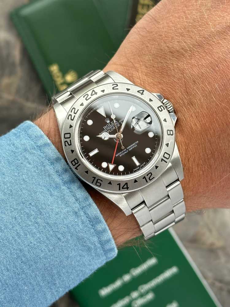 Wrist image for Rolex Explorer 2 "Engraved Rehaut" 16570T Black 2009 with original box and papers