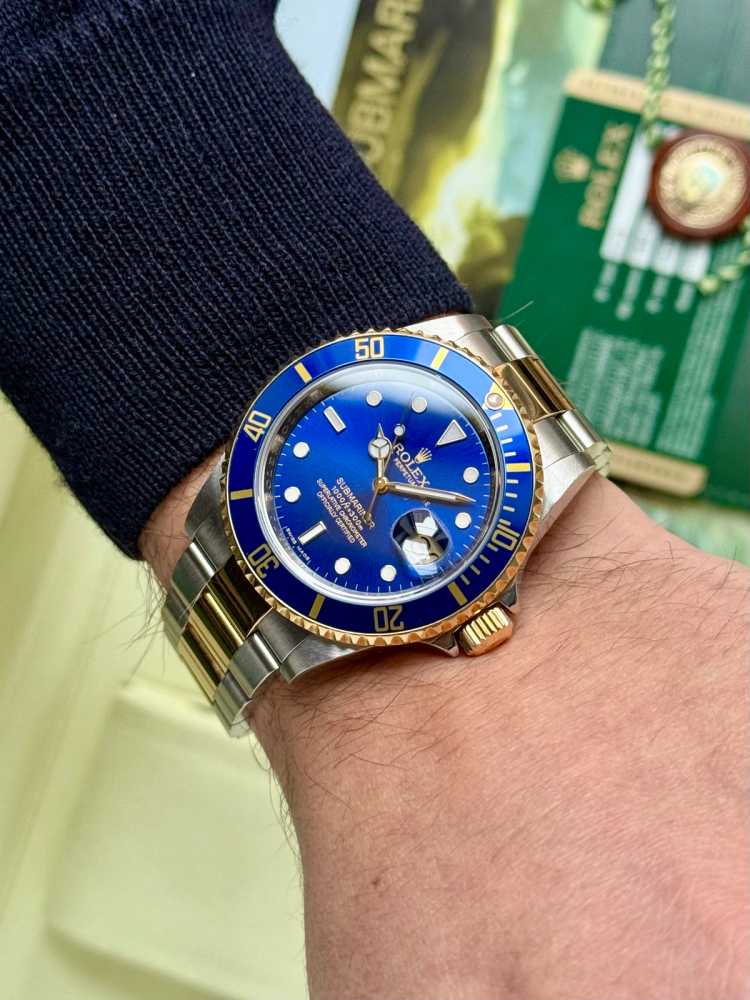 Wrist shot image for Rolex Submariner 16613 Blue 2009 with original box and papers