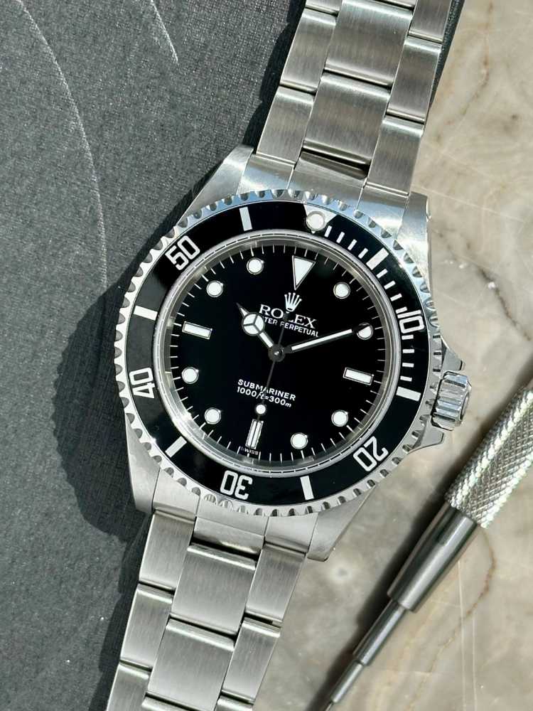 Featured image for Rolex Submariner "Swiss" 14060 Black 1998 